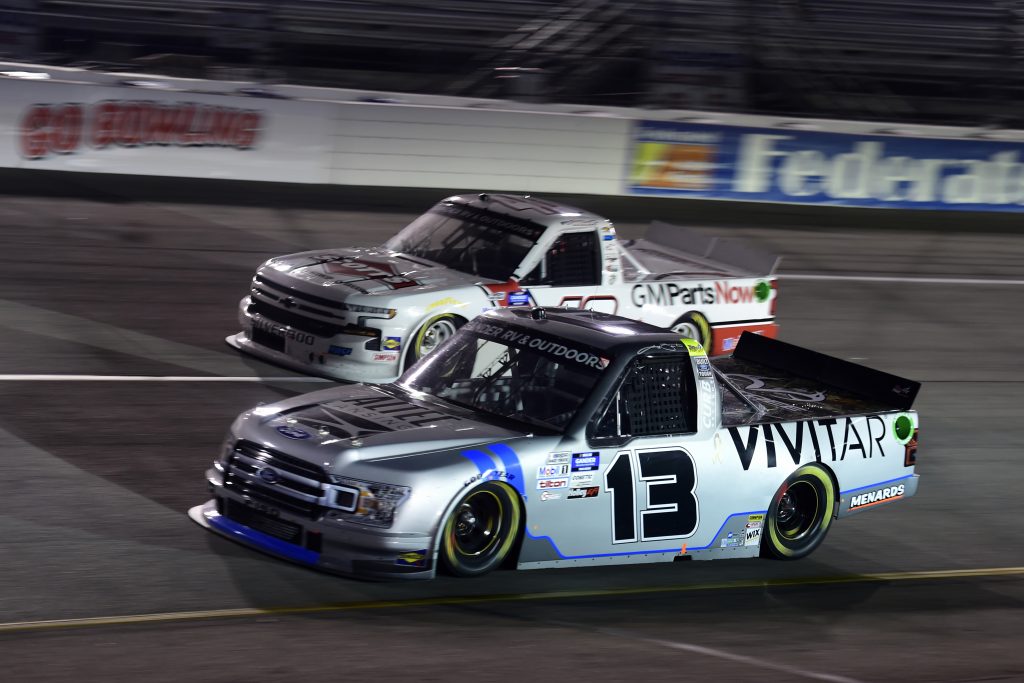 RICHMOND, VIRGINIA - SEPTEMBER 10: Johnny Sauter, driver of the #13 Vivitar Ford, and Carson Hocevar, driver of the #40 Scott's Chevrolet, race during the NASCAR Gander Outdoors Truck Series ToyotaCare 250 at Richmond Raceway on September 10, 2020 in Richmond, Virginia. (Photo by Jared C. Tilton/Getty Images) | Getty Images