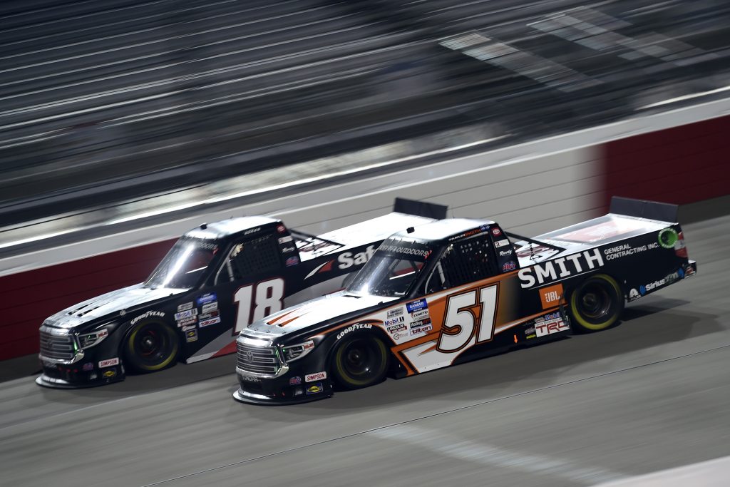 RICHMOND, VIRGINIA - SEPTEMBER 10: Chandler Smith, driver of the #51 JBL/Smith General Contracting Toyota, and Christian Eckes, driver of the #18 Safelite AutoGlass Toyota, race during the NASCAR Gander Outdoors Truck Series ToyotaCare 250 at Richmond Raceway on September 10, 2020 in Richmond, Virginia. (Photo by Jared C. Tilton/Getty Images) | Getty Images