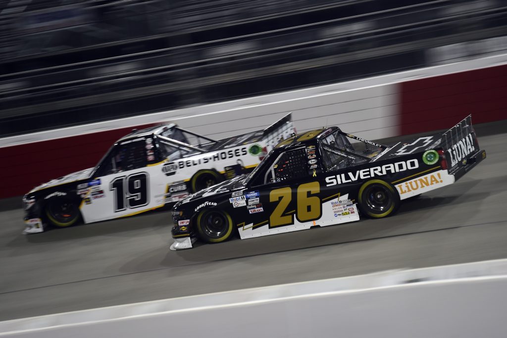 RICHMOND, VIRGINIA - SEPTEMBER 10: Tyler Ankrum, driver of the #26 Chevy Silverado Chevrolet, and Derek Kraus, driver of the #19 Gates Hydraulics/NAPA Belts & Hoses Toyota, race during the NASCAR Gander Outdoors Truck Series ToyotaCare 250 at Richmond Raceway on September 10, 2020 in Richmond, Virginia. (Photo by Jared C. Tilton/Getty Images) | Getty Images