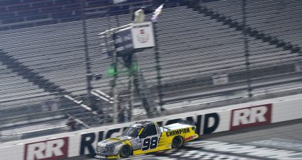 RICHMOND, VIRGINIA - SEPTEMBER 10: Grant Enfinger, driver of the #98 Champion/Curb Records Ford, crosses the finish line to win the NASCAR Gander Outdoors Truck Series ToyotaCare 250 at Richmond Raceway on September 10, 2020 in Richmond, Virginia. (Photo by Jared C. Tilton/Getty Images) | Getty Images