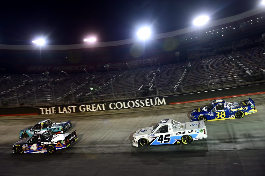 BRISTOL, TENNESSEE - SEPTEMBER 17: Raphael Lessard, driver of the #4 Canac Toyota, Ben Rhodes, driver of the #99 Tenda Heal Ford, Trevor Bayne, driver of the #45 Proceller8 Chevrolet, and Todd Gilliland, driver of the #38 Speedco Ford, race during the NASCAR Gander RV & Outdoors Truck Series UNOH 200 presented by Ohio Logistics at Bristol Motor Speedway on September 17, 2020 in Bristol, Tennessee. (Photo by Jared C. Tilton/Getty Images) | Getty Images