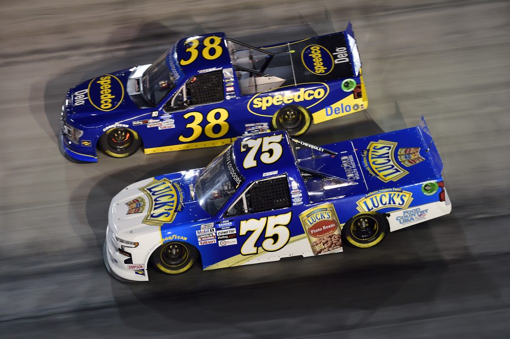 BRISTOL, TENNESSEE - SEPTEMBER 17: Parker Kligerman, driver of the #75 Food Country USA Chevrolet, and Todd Gilliland, driver of the #38 Speedco Ford, race during the NASCAR Gander RV & Outdoors Truck Series UNOH 200 presented by Ohio Logistics at Bristol Motor Speedway on September 17, 2020 in Bristol, Tennessee. (Photo by Jared C. Tilton/Getty Images) | Getty Images