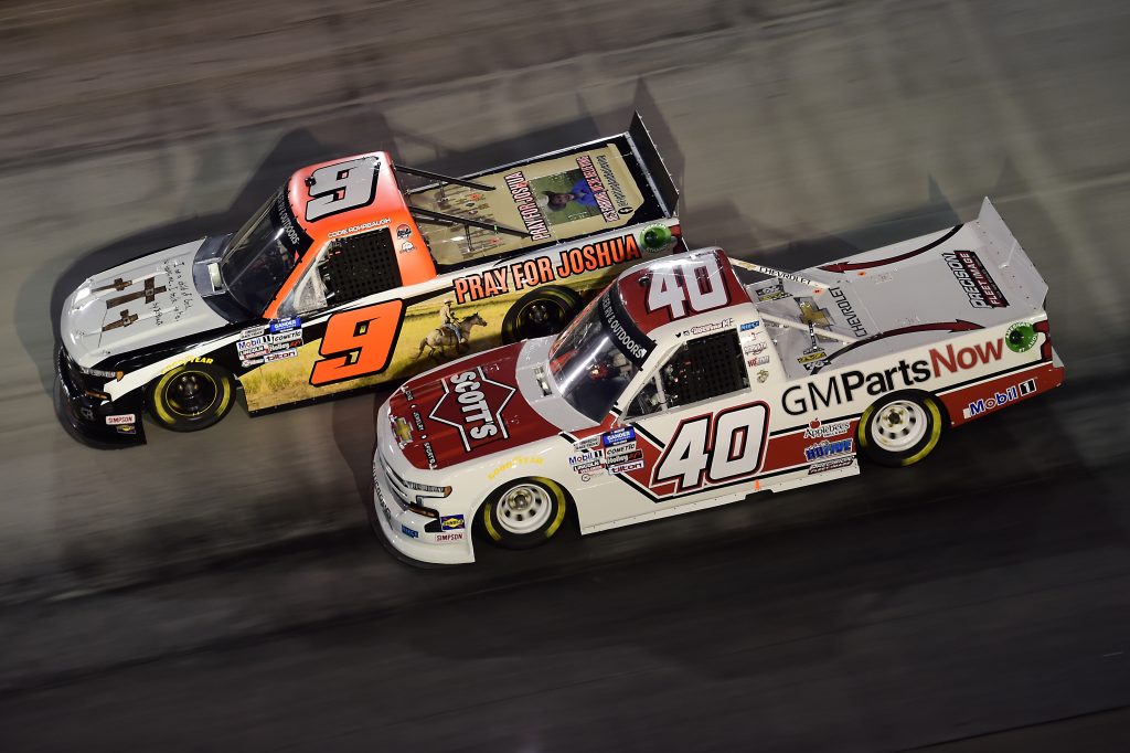 BRISTOL, TENNESSEE - SEPTEMBER 17: Carson Hocevar, driver of the #40 Scott's Chevrolet, and Codie Rohrbaugh, driver of the #9 Pray for Joshua Chevrolet, race during the NASCAR Gander RV & Outdoors Truck Series UNOH 200 presented by Ohio Logistics at Bristol Motor Speedway on September 17, 2020 in Bristol, Tennessee. (Photo by Jared C. Tilton/Getty Images) | Getty Images