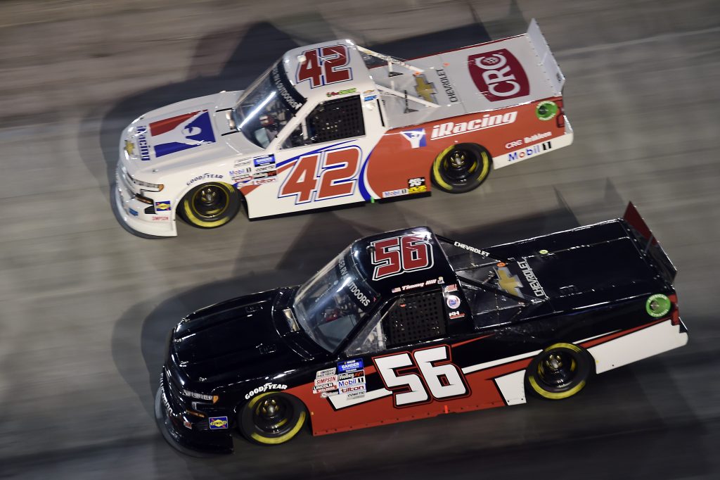 BRISTOL, TENNESSEE - SEPTEMBER 17: Timmy Hill, driver of the #56 Hill Motorsports Chevrolet, and Ross Chastain, driver of the #42 Chevrolet, race during the NASCAR Gander RV & Outdoors Truck Series UNOH 200 presented by Ohio Logistics at Bristol Motor Speedway on September 17, 2020 in Bristol, Tennessee. (Photo by Jared C. Tilton/Getty Images) | Getty Images