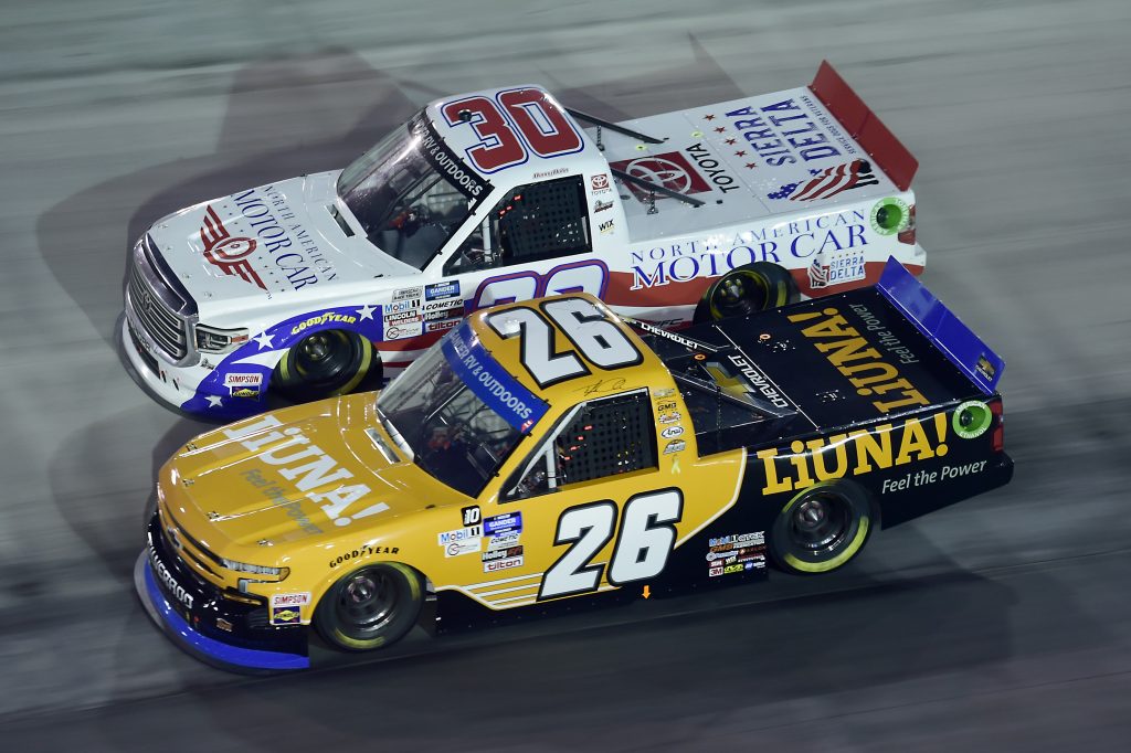BRISTOL, TENNESSEE - SEPTEMBER 17: Tyler Ankrum, driver of the #26 LiUNA! Chevrolet, and Danny Bohn, driver of the #30 North American Motor Car/Sierra Delta Toyota, race during the NASCAR Gander RV & Outdoors Truck Series UNOH 200 presented by Ohio Logistics at Bristol Motor Speedway on September 17, 2020 in Bristol, Tennessee. (Photo by Jared C. Tilton/Getty Images) | Getty Images