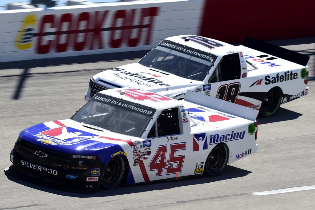DARLINGTON, SOUTH CAROLINA - SEPTEMBER 06: Ty Majeski, driver of the #45 Plan B Sales Chevrolet, and Christian Eckes, driver of the #18 Safelite AutoGlass Toyota, race during the NASCAR Gander Outdoors Truck Series South Carolina Education Lottery 200 at Darlington Raceway on September 06, 2020 in Darlington, South Carolina. (Photo by Jared C. Tilton/Getty Images) | Getty Images