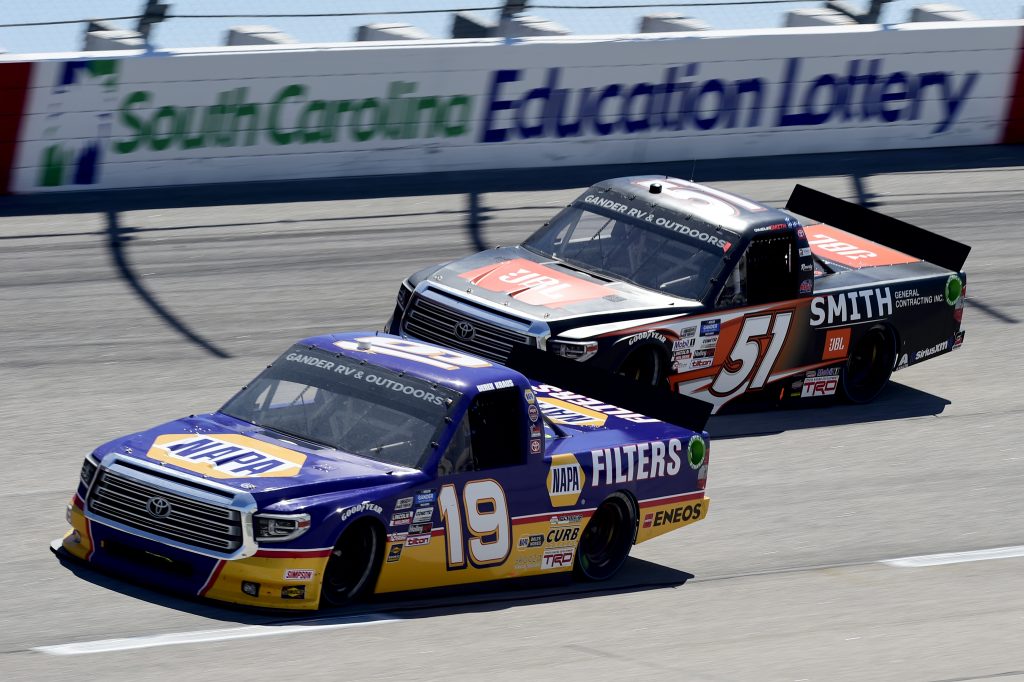 DARLINGTON, SOUTH CAROLINA - SEPTEMBER 06: Derek Kraus, driver of the #19 Ron Hornaday Throwback Toyota, and Chandler Smith, driver of the #51 JBL/Smith General Contracting Toyota, race during the NASCAR Gander Outdoors Truck Series South Carolina Education Lottery 200 at Darlington Raceway on September 06, 2020 in Darlington, South Carolina. (Photo by Jared C. Tilton/Getty Images) | Getty Images