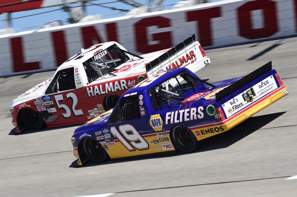 DARLINGTON, SOUTH CAROLINA - SEPTEMBER 06: Derek Kraus, driver of the #19 Ron Hornaday Throwback Toyota, and Stewart Friesen, driver of the #52 Halmar Racing To Beat Hunger Toyota, race during the NASCAR Gander Outdoors Truck Series South Carolina Education Lottery 200 at Darlington Raceway on September 06, 2020 in Darlington, South Carolina. (Photo by Jared C. Tilton/Getty Images) | Getty Images