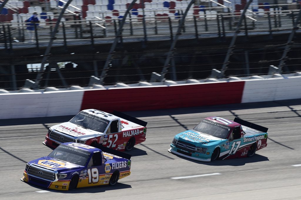 DARLINGTON, SOUTH CAROLINA - SEPTEMBER 06: Derek Kraus, driver of the #19 Ron Hornaday Throwback Toyota, Stewart Friesen, driver of the #52 Halmar Racing To Beat Hunger Toyota, and David Ragan, driver of the #17 Shriners Hospitals Ford, race during the NASCAR Gander Outdoors Truck Series South Carolina Education Lottery 200 at Darlington Raceway on September 06, 2020 in Darlington, South Carolina. (Photo by Jared C. Tilton/Getty Images) | Getty Images