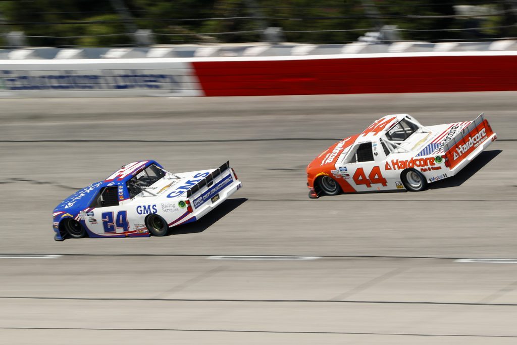 DARLINGTON, SOUTH CAROLINA - SEPTEMBER 06: Greg Biffle, driver of the #24 GMS Services Chevrolet, and Bayley Currey, driver of the #44 Hardcore Fish & Game Chevrolet, race during the NASCAR Gander Outdoors Truck Series South Carolina Education Lottery 200 at Darlington Raceway on September 06, 2020 in Darlington, South Carolina. (Photo by Chris Keane/Getty Images) | Getty Images