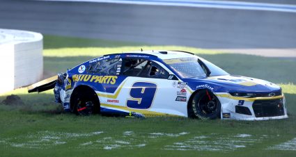 CONCORD, NORTH CAROLINA - OCTOBER 10: Chase Elliott, driver of the #9 NAPA Auto Parts Chevrolet, sits in the grass after an on-track incident during the NASCAR Cup Series Bank of America ROVAL 400 at Charlotte Motor Speedway on October 10, 2021 in Concord, North Carolina. (Photo by Brian Lawdermilk/Getty Images) | Getty Images