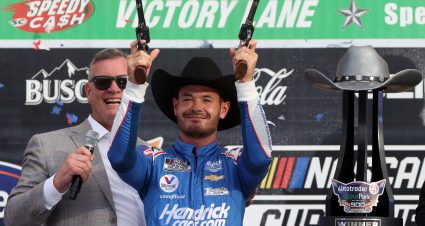 FORT WORTH, TEXAS - OCTOBER 17: Kyle Larson, driver of the #5 HendrickCars.com Chevrolet, celebrates in victory lane with Senior Vice President and General Manager of Texas Motor Speedway, Rob Ramage after winning the NASCAR Cup Series Autotrader EchoPark Automotive 500 at Texas Motor Speedway on October 17, 2021 in Fort Worth, Texas. (Photo by Chris Graythen/Getty Images) | Getty Images