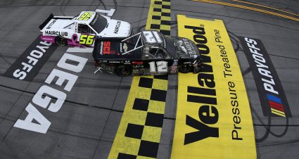 TALLADEGA, ALABAMA - OCTOBER 02: Tate Fogleman, driver of the #12 Traeger Grills Chevrolet, is involved in an on-track incident with Tyler Hill, driver of the #56 HairClub Chevrolet, at the finish line after winning the NASCAR Camping World Truck Series Chevrolet Silverado 250 at Talladega Superspeedway on October 02, 2021 in Talladega, Alabama. (Photo by Sean Gardner/Getty Images) | Getty Images