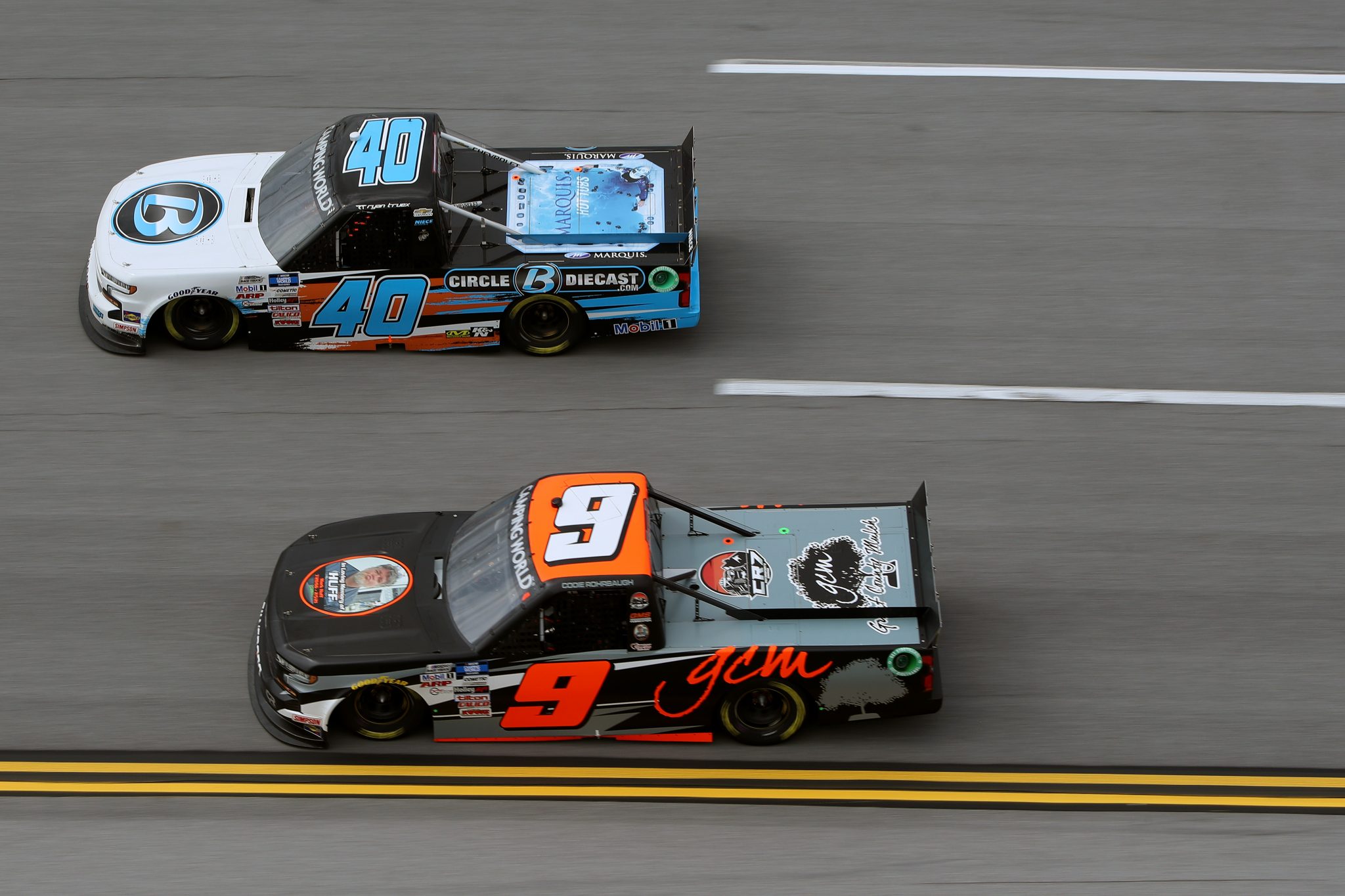 TALLADEGA, ALABAMA - OCTOBER 02: Codie Rohrbaugh, driver of the #9 Grant County Mulch Chevrolet, and Ryan Truex, driver of the #40 CircleBDiecast.com Chevrolet, race during the NASCAR Camping World Truck Series Chevrolet Silverado 250 at Talladega Superspeedway on October 02, 2021 in Talladega, Alabama. (Photo by Sean Gardner/Getty Images) | Getty Images