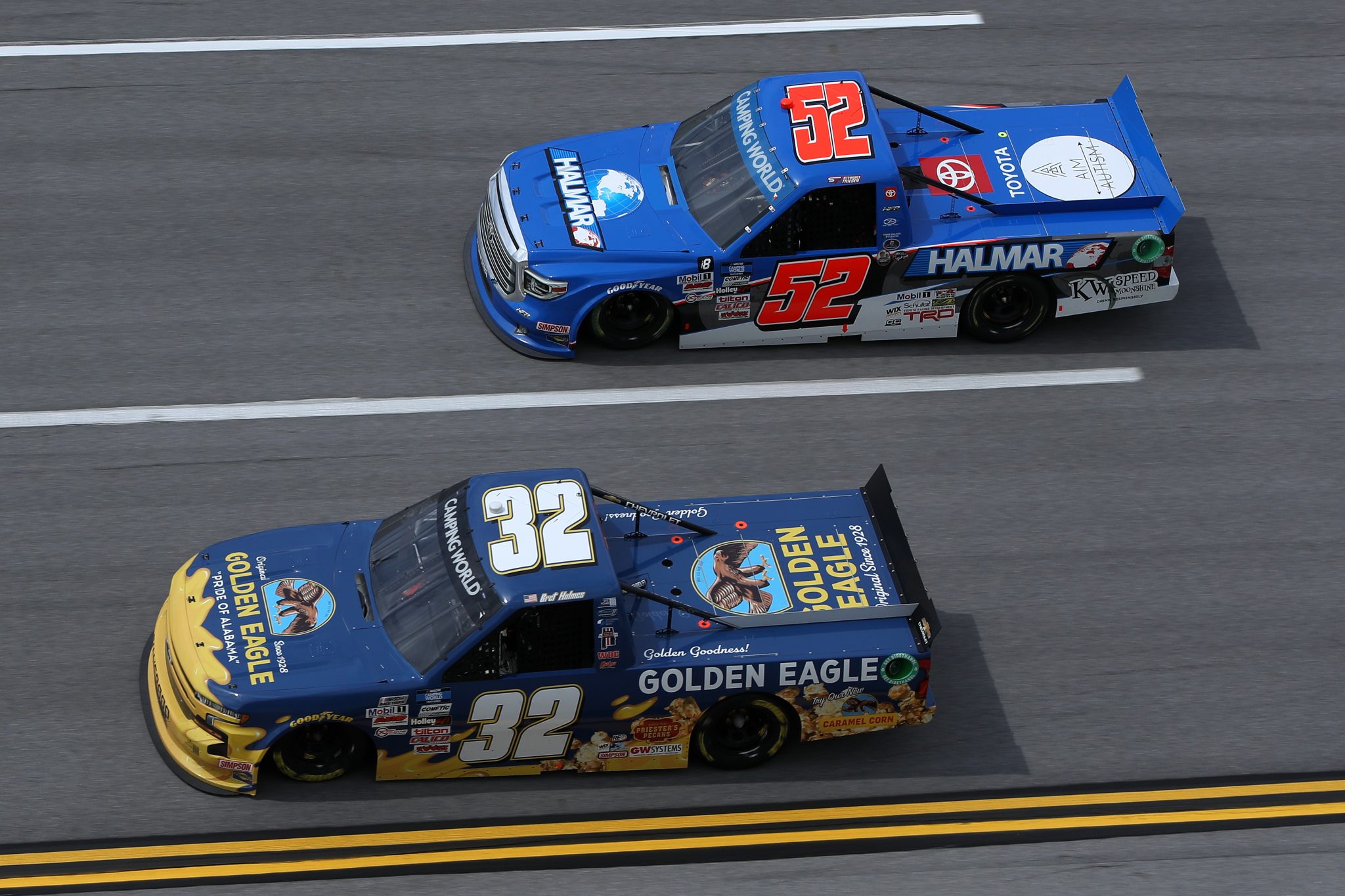 TALLADEGA, ALABAMA - OCTOBER 02: Bret Holmes, driver of the #32 GOLDEN EAGLE Chevrolet, and Stewart Friesen, driver of the #52 Halmar International Toyota, race during the NASCAR Camping World Truck Series Chevrolet Silverado 250 at Talladega Superspeedway on October 02, 2021 in Talladega, Alabama. (Photo by Sean Gardner/Getty Images) | Getty Images