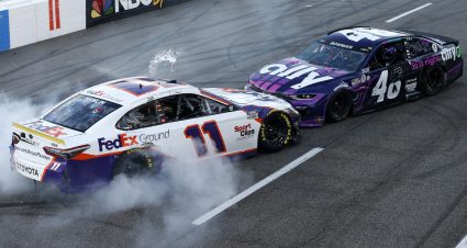 MARTINSVILLE, VIRGINIA - OCTOBER 31: Denny Hamlin, driver of the #11 FedEx Ground Toyota, impedes Alex Bowman, driver of the #48 Ally Chevrolet, celebration after winning the NASCAR Cup Series Xfinity 500 at Martinsville Speedway on October 31, 2021 in Martinsville, Virginia. (Photo by Brian Lawdermilk/Getty Images) | Getty Images