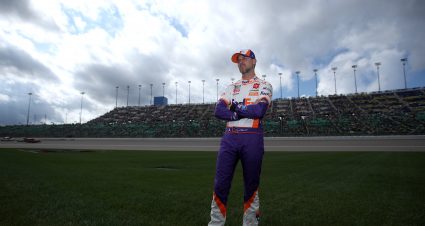 KANSAS CITY, KANSAS - OCTOBER 24: Denny Hamlin, driver of the #11 FedEx Freight Toyota, waits on the infield grass prior to the NASCAR Cup Series Hollywood Casino 400 at Kansas Speedway on October 24, 2021 in Kansas City, Kansas. (Photo by Sean Gardner/Getty Images) | Getty Images