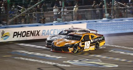 AVONDALE, ARIZONA - NOVEMBER 06: Daniel Hemric, driver of the #18 Poppy Bank Toyota, crosses the finish line ahead of Austin Cindric, driver of the #22 CarShop Ford, to win the NASCAR Xfinity Series Championship at Phoenix Raceway on November 06, 2021 in Avondale, Arizona. (Photo by Jared C. Tilton/Getty Images) | Getty Images