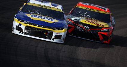 AVONDALE, ARIZONA - NOVEMBER 07: Chase Elliott, driver of the #9 NAPA Auto Parts Chevrolet, and Martin Truex Jr., driver of the #19 Bass Pro Shops Toyota, race during the NASCAR Cup Series Championship at Phoenix Raceway on November 07, 2021 in Avondale, Arizona. (Photo by Sean Gardner/Getty Images) | Getty Images