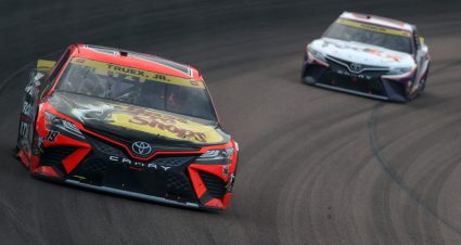 AVONDALE, ARIZONA - NOVEMBER 07: Martin Truex Jr., driver of the #19 Bass Pro Shops Toyota, and Denny Hamlin, driver of the #11 FedEx Express Toyota,  race during the NASCAR Cup Series Championship at Phoenix Raceway on November 07, 2021 in Avondale, Arizona. (Photo by Christian Petersen/Getty Images) | Getty Images