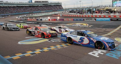 AVONDALE, ARIZONA - NOVEMBER 07: Kyle Larson, driver of the #5 HendrickCars.com Chevrolet, Martin Truex Jr., driver of the #19 Bass Pro Shops Toyota, and Denny Hamlin, driver of the #11 FedEx Express Toyota, race during the NASCAR Cup Series Championship at Phoenix Raceway on November 07, 2021 in Avondale, Arizona. (Photo by Christian Petersen/Getty Images) | Getty Images
