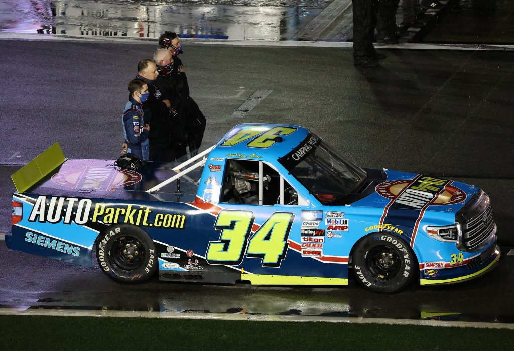 DAYTONA BEACH, FLORIDA - FEBRUARY 19: Lawless Alan, driver of the #34 AUTOPARKIT.com Toyota, and crew standing on pit road during the national anthem prior to the NASCAR Camping World Truck Series BrakeBest Brake Pads 159 At Daytona Presented by O'Reilly at Daytona International Speedway on February 19, 2021 in Daytona Beach, Florida. (Photo by James Gilbert/Getty Images) | Getty Images