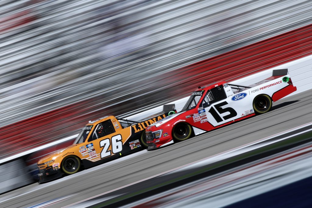 HAMPTON, GEORGIA - MARCH 20: Tyler Ankrum, driver of the #26 LiUNA! Chevrolet, and Tanner Gray, driver of the #15 Ford Performance Ford, race during the NASCAR Camping World Truck Series Fr8Auctions 200 at Atlanta Motor Speedway on March 20, 2021 in Hampton, Georgia. (Photo by Sean Gardner/Getty Images) | Getty Images