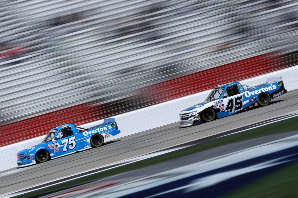 HAMPTON, GEORGIA - MARCH 20: Parker Kligerman, driver of the #75 Overton's Chevrolet, and Brett Moffitt, driver of the #45 Overton's Chevrolet, race during the NASCAR Camping World Truck Series Fr8Auctions 200 at Atlanta Motor Speedway on March 20, 2021 in Hampton, Georgia. (Photo by Sean Gardner/Getty Images) | Getty Images