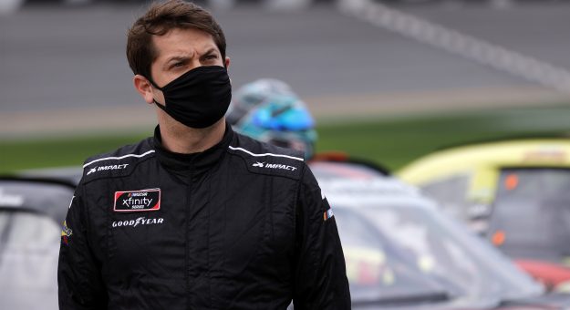 DAYTONA BEACH, FLORIDA - FEBRUARY 13: Landon Cassill, driver of the #4 Blue Emu Chevrolet, waits on the grid prior to the NASCAR Xfinity Series Beef. It's What's For Dinner. 300 at Daytona International Speedway on February 13, 2021 in Daytona Beach, Florida. (Photo by Jared C. Tilton/Getty Images) | Getty Images