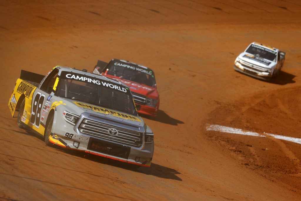 BRISTOL, TENNESSEE - MARCH 26: Grant Enfinger, driver of the #98 Champion/Curb Records Toyota, drives during practice for the NASCAR Camping World Truck Series Pinty's Truck Race on Dirt at Bristol Motor Speedway on March 26, 2021 in Bristol, Tennessee. (Photo by Jared C. Tilton/Getty Images) | Getty Images