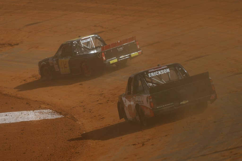 BRISTOL, TENNESSEE - MARCH 26: Cody Erickson, driver of the #41 Cram Enterprises Chevrolet, and Trevor Collins, driver of the #83 CMI Insulation Chevrolet, race during practice for the NASCAR Camping World Truck Series Pinty's Truck Race on Dirt at Bristol Motor Speedway on March 26, 2021 in Bristol, Tennessee. (Photo by Jared C. Tilton/Getty Images) | Getty Images
