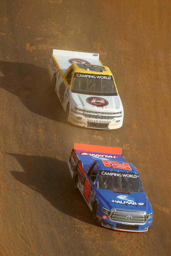 BRISTOL, TENNESSEE - MARCH 26: Jessica Friesen, driver of the #62 Halmar International Toyota, and Brett Moffitt, driver of the #45 Circle B Diecast Chevrolet, race during practice for the NASCAR Camping World Truck Series Pinty's Truck Race on Dirt at Bristol Motor Speedway on March 26, 2021 in Bristol, Tennessee. (Photo by Jared C. Tilton/Getty Images) | Getty Images