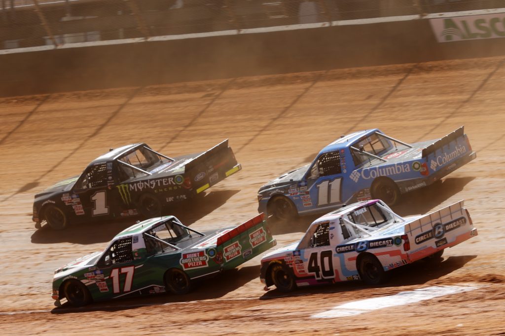 BRISTOL, TENNESSEE - MARCH 29: Hailie Deegan, driver of the #1 Monster Ford, Kevin Harvick, driver of the #17 Hunt Brothers Pizza Ford, Ryan Truex, driver of the #40 CircleBDiecast.com Chevrolet, and Bubba Wallace, driver of the #11 Columbia Outdoor Clothing Toyota, race during the NASCAR Camping World Truck Series Pinty's Truck Race on Dirt at Bristol Motor Speedway on March 29, 2021 in Bristol, Tennessee. (Photo by Chris Graythen/Getty Images) | Getty Images