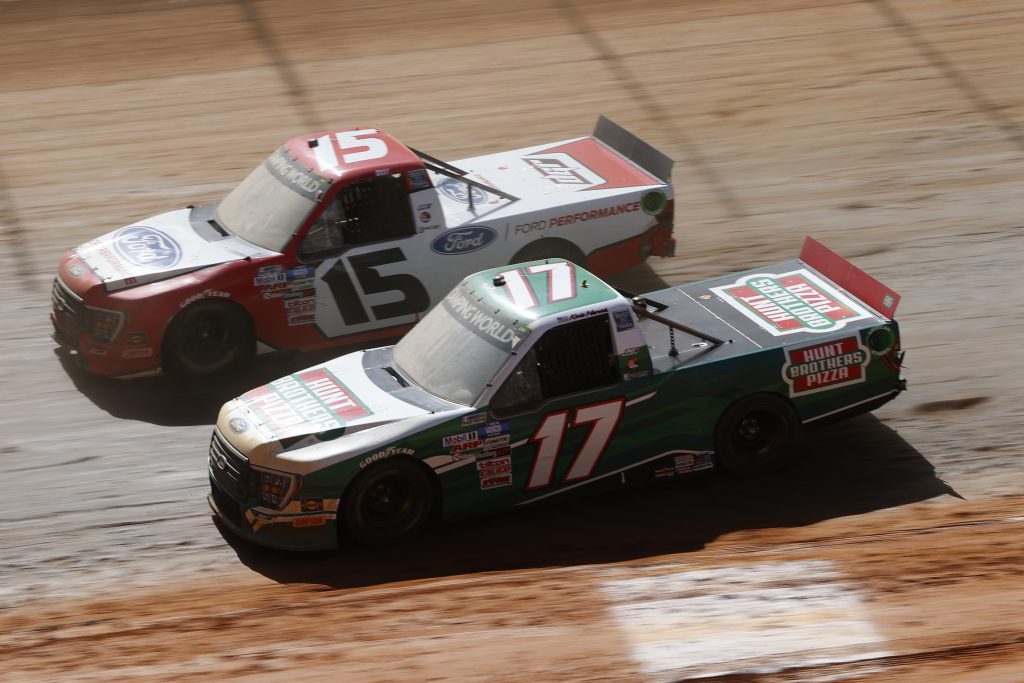 BRISTOL, TENNESSEE - MARCH 29: Kevin Harvick, driver of the #17 Hunt Brothers Pizza Ford, and Tanner Gray, driver of the #15 Ford Performance Ford, race during the NASCAR Camping World Truck Series Pinty's Truck Race on Dirt at Bristol Motor Speedway on March 29, 2021 in Bristol, Tennessee. (Photo by Chris Graythen/Getty Images) | Getty Images