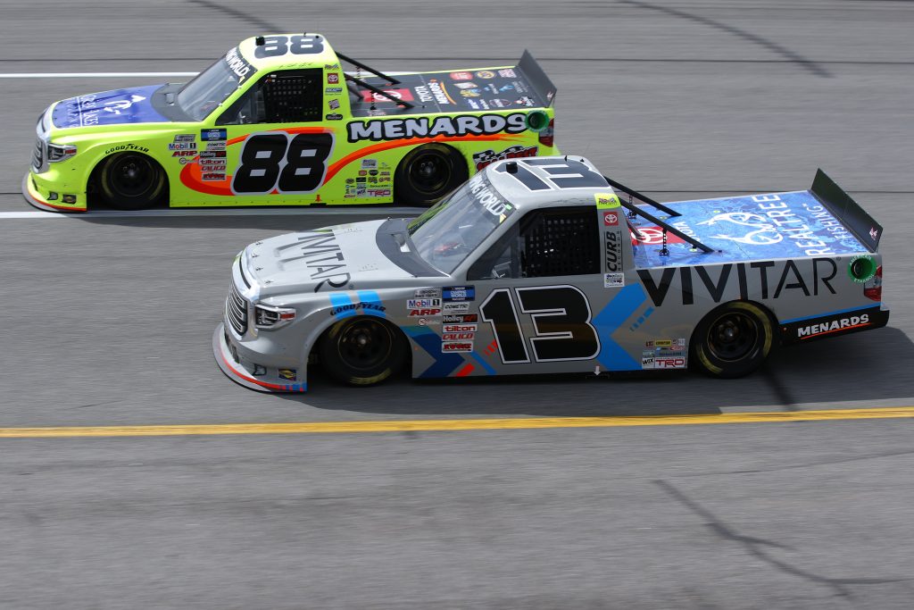 RICHMOND, VIRGINIA - APRIL 17: Johnny Sauter, driver of the #13 Vivitar Toyota, and Matt Crafton, driver of the #88 Great Lakes Flooring/Menards Toyota, race during the NASCAR Camping World Truck Series ToyotaCare 250 at Richmond Raceway on April 17, 2021 in Richmond, Virginia. (Photo by Sean Gardner/Getty Images) | Getty Images