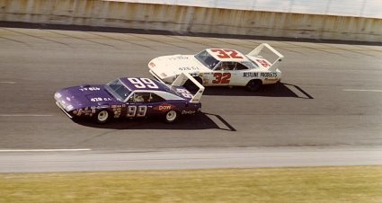 DAYTONA BEACH, FL - FEBRUARY 22, 1970:  Charlie Glotzbach with the Dodge Daytona #99 and Dick Brooks (No. 32). Chargin' Charlie wins the first NASCAR race ever run with the cars using a carburetor restrictor plate to slow the cars down and save equipment. That was at Michigan in AUGUST 1970.  (Photo by ISC Archives/CQ-Roll Call Group via Getty Images)