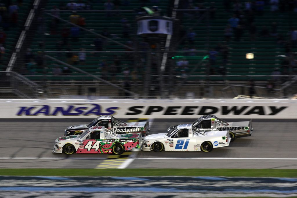 KANSAS CITY, KANSAS - MAY 01: Ross Chastain, driver of the #44 Circle B Diecast Chevrolet, and Zane Smith, driver of the #21 Chevrolet, race during the NASCAR Camping World Truck Series Wise Power 200 at Kansas Speedway on May 01, 2021 in Kansas City, Kansas. (Photo by Sean Gardner/Getty Images) | Getty Images