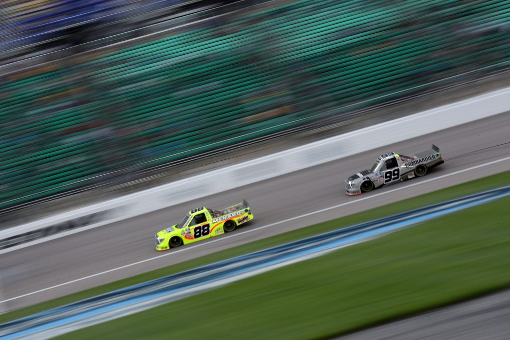 KANSAS CITY, KANSAS - MAY 01: Ben Rhodes, driver of the #99 Bombardier LearJet 75 Toyota, and Matt Crafton, driver of the #88 Ideal Door/Menards Toyota, race during the NASCAR Camping World Truck Series Wise Power 200 at Kansas Speedway on May 01, 2021 in Kansas City, Kansas. (Photo by Sean Gardner/Getty Images) | Getty Images
