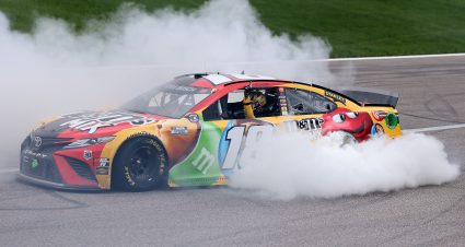 KANSAS CITY, KANSAS - MAY 02: Kyle Busch, driver of the #18 M&M's Mix Toyota, celebrates with a burnout after winning the NASCAR Cup Series Buschy McBusch Race 400 at Kansas Speedway on May 02, 2021 in Kansas City, Kansas. (Photo by James Gilbert/Getty Images) | Getty Images