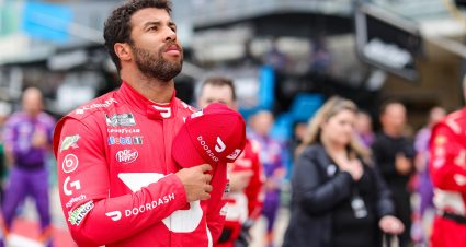 AUSTIN, TEXAS - MAY 23: Bubba Wallace, driver of the #23 DoorDash Toyota, stands during the national anthem prior to the NASCAR Cup Series EchoPark Texas Grand Prix at Circuit of The Americas on May 23, 2021 in Austin, Texas. (Photo by Carmen Mandato/23XI Racing via Getty Images)