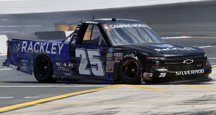 CONCORD, NORTH CAROLINA - MAY 28: Timothy Peters, driver of the #25 Rackley Roofing Chevrolet, damaged truck spins on the grid during practice for the NASCAR Camping World Truck Series North Carolina Education Lottery 200 at Charlotte Motor Speedway on May 28, 2021 in Concord, North Carolina. (Photo by Maddie Meyer/Getty Images) | Getty Images