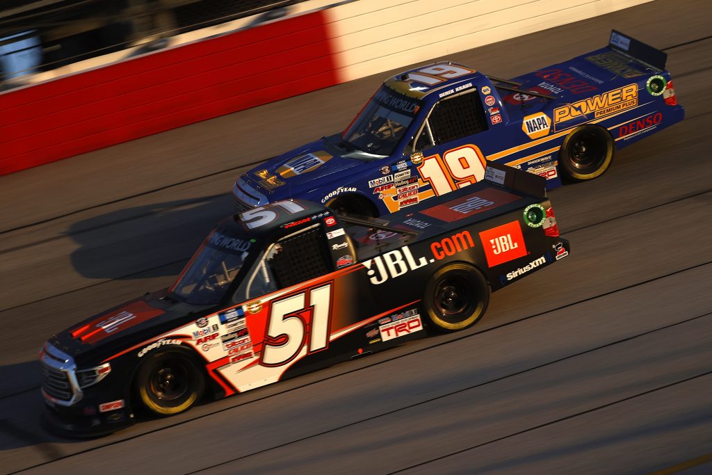 DARLINGTON, SOUTH CAROLINA - MAY 07: Corey Heim, driver of the #51 JBL Toyota, and Derek Kraus, driver of the #19 NAPA Power Premium Plus Toyota, race during the NASCAR Camping World Truck Series LiftKits4Less.com 200 at Darlington Raceway on May 07, 2021 in Darlington, South Carolina. (Photo by Chris Graythen/Getty Images) | Getty Images