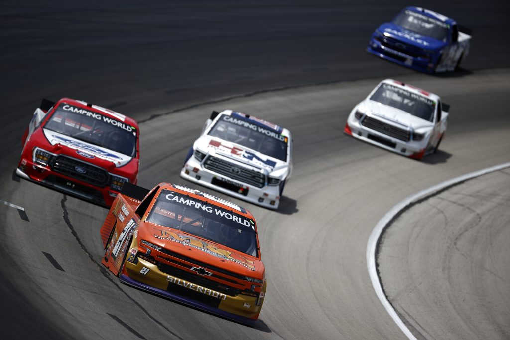 FORT WORTH, TEXAS - JUNE 12: Zane Smith, driver of the #21 MRC Construction Chevrolet, Tanner Gray, driver of the #15 Ford Performance Ford, and Derek Kraus, driver of the #19 HunterNation Toyota, race during the NASCAR Camping World Truck Series SpeedyCash.com 220 at Texas Motor Speedway on June 12, 2021 in Fort Worth, Texas. (Photo by Jared C. Tilton/Getty Images) | Getty Images