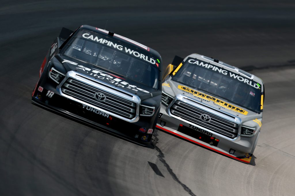 FORT WORTH, TEXAS - JUNE 12: Chandler Smith, driver of the #18 Safelite AutoGlass Toyota, and Grant Enfinger, driver of the #98 Champion/Curb Records Toyota, race during the NASCAR Camping World Truck Series SpeedyCash.com 220 at Texas Motor Speedway on June 12, 2021 in Fort Worth, Texas. (Photo by Sean Gardner/Getty Images) | Getty Images