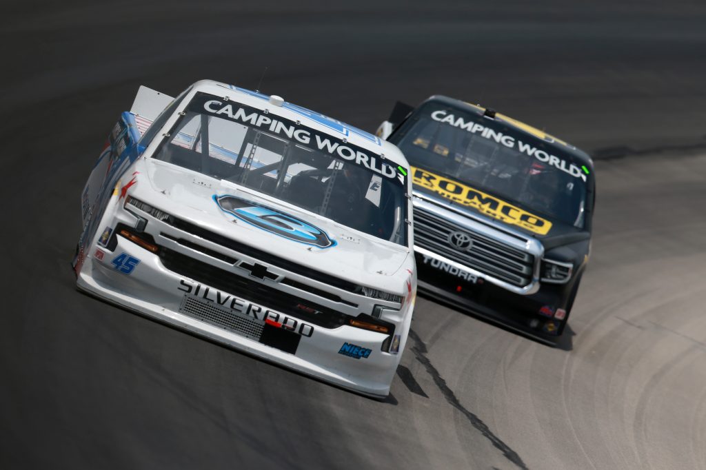 FORT WORTH, TEXAS - JUNE 12: Ross Chastain, driver of the #45 Circle B Diecast Chevrolet, and John Hunter Nemechek, driver of the #4 ROMCO Toyota, race during the NASCAR Camping World Truck Series SpeedyCash.com 220 at Texas Motor Speedway on June 12, 2021 in Fort Worth, Texas. (Photo by Sean Gardner/Getty Images) | Getty Images