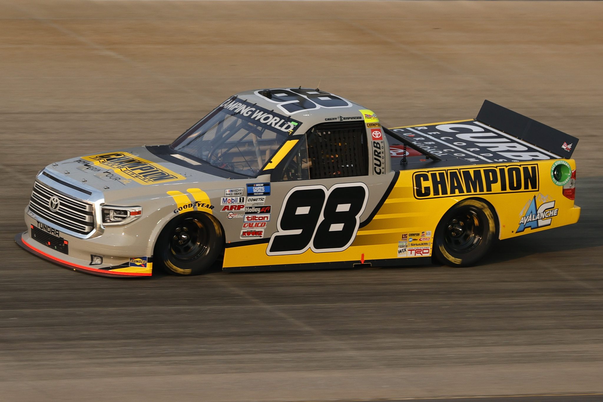 LEBANON, TENNESSEE - JUNE 18: Grant Enfinger, driver of the #98 Champion/Curb Records Toyota, exits the grid to start the NASCAR Camping World Truck Series Rackley Roofing 200 at Nashville Superspeedway on June 18, 2021 in Lebanon, Tennessee. (Photo by Sarah Stier/Getty Images) | Getty Images