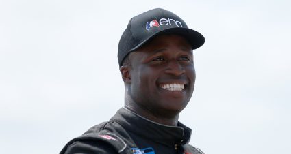 FORT WORTH, TEXAS - JUNE 12: Jesse Iwuji, driver of the #34 eRacing Association/Gap Em Toyota, smiles during pre-race ceremonies prior to the NASCAR Camping World Truck Series SpeedyCash.com 220 at Texas Motor Speedway on June 12, 2021 in Fort Worth, Texas. (Photo by Sean Gardner/Getty Images) | Getty Images