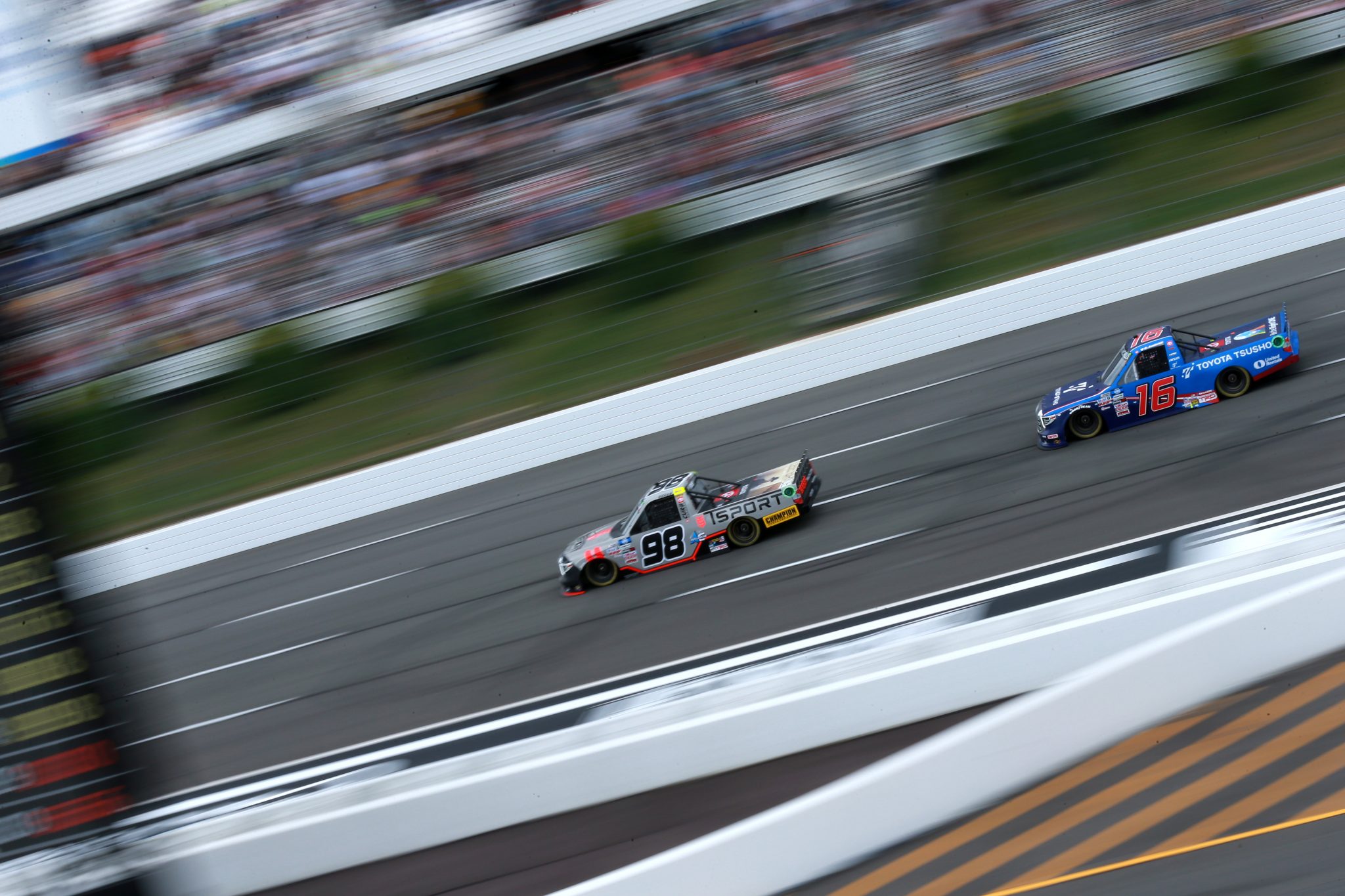 LONG POND, PENNSYLVANIA - JUNE 26: Christian Eckes, driver of the #98 Toyota, and Austin Hill, driver of the #16 Toyota Tsusho Toyota, race during the NASCAR Camping World Truck Series CRC Brakleen 150 at Pocono Raceway on June 26, 2021 in Long Pond, Pennsylvania. (Photo by Sean Gardner/Getty Images) | Getty Images