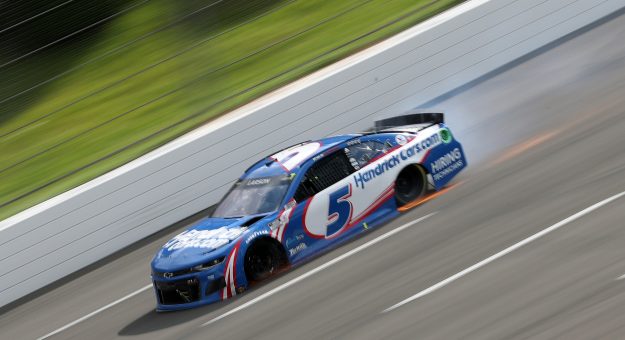 LONG POND, PENNSYLVANIA - JUNE 26: Kyle Larson, driver of the #5 HendrickCars.com Chevrolet, drives with a flat tire on the final turn of the NASCAR Cup Series Pocono Organics CBD 325 at Pocono Raceway on June 26, 2021 in Long Pond, Pennsylvania. (Photo by James Gilbert/Getty Images) | Getty Images