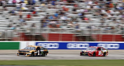 HAMPTON, GEORGIA - JULY 11: Kurt Busch, driver of the #1 GEARWRENCH Chevrolet, leads Kyle Busch, driver of the #18 Skittles Gummies Toyota, on the last lap to win the NASCAR Cup Series Quaker State 400 presented by Walmart at Atlanta Motor Speedway on July 11, 2021 in Hampton, Georgia. (Photo by Jared C. Tilton/Getty Images) | Getty Images
